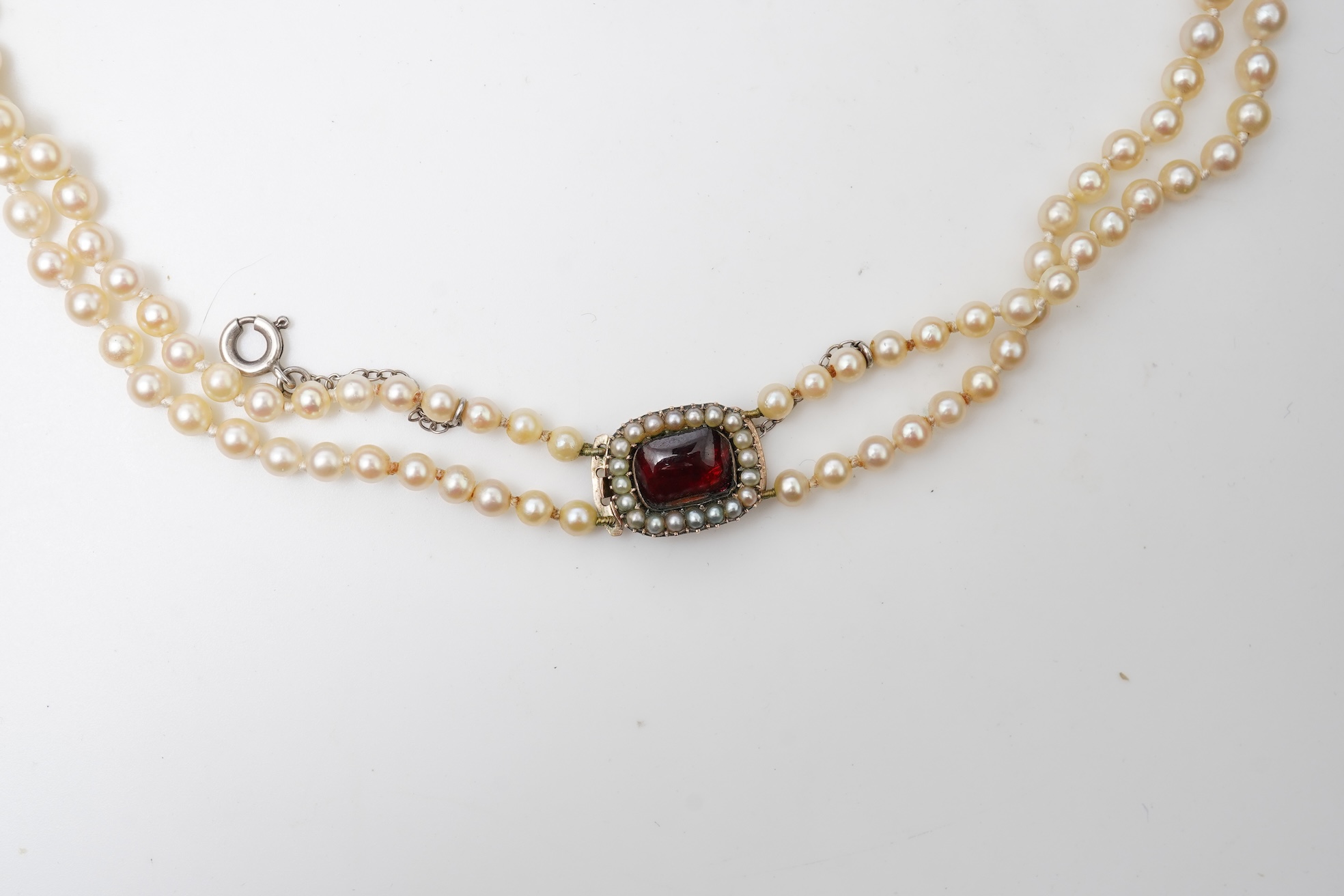 A cultured pearl and garnet necklace, 19th century and later